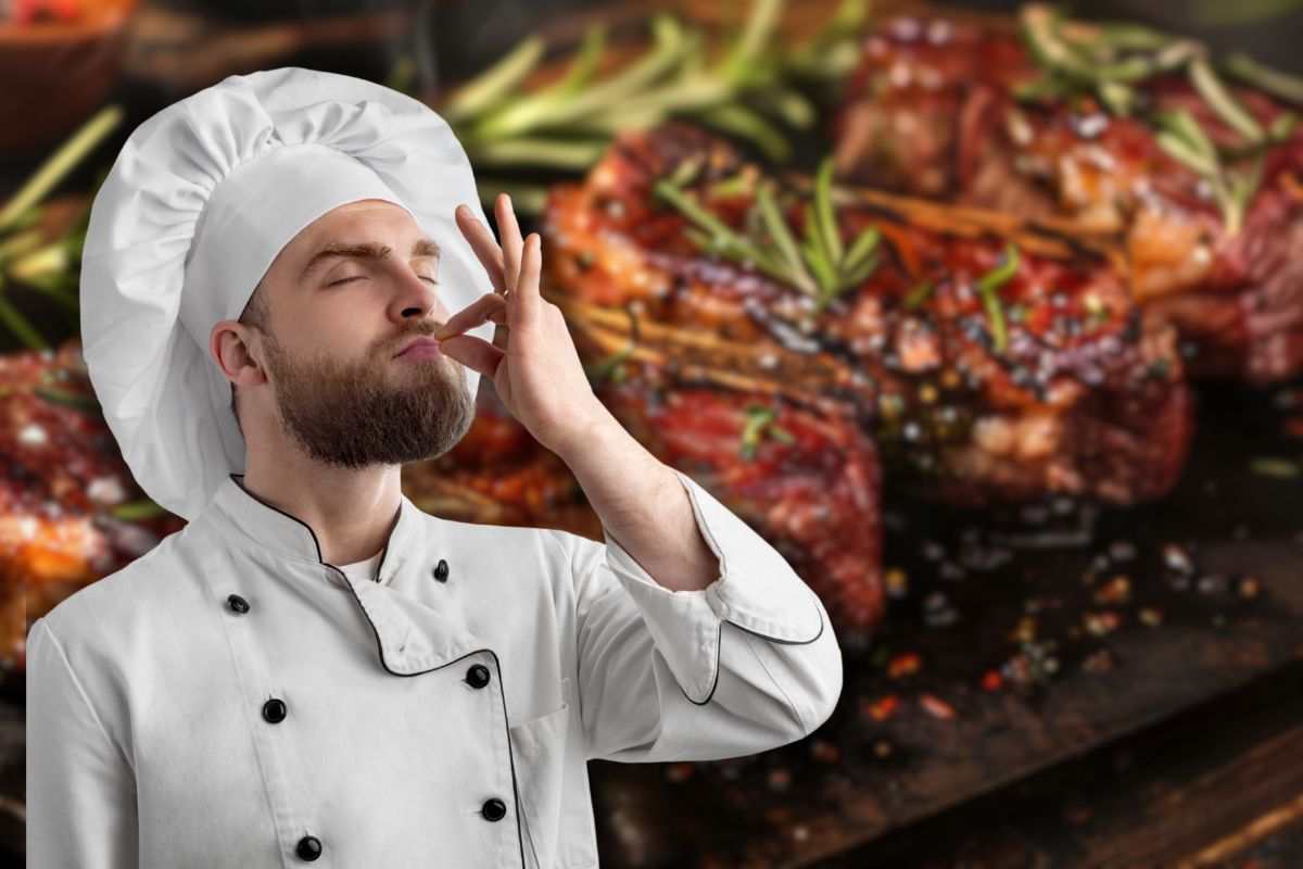 carne alla griglia e chef che manda bacio